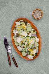 Salad of cucumbers, cheese, capers and lemon zest