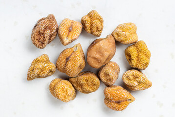 several raw black chickpeas close up on gray
