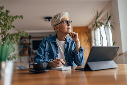 Senior woman, making plans for work.