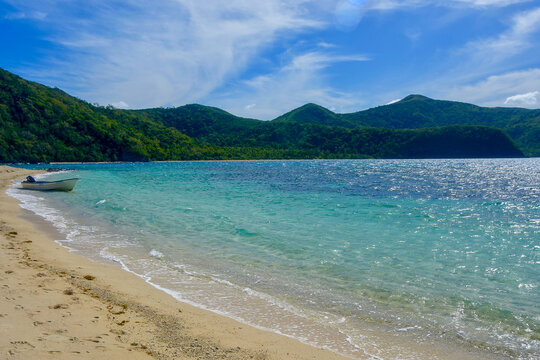 South Pacific Dreams of lush green tropical mountains behind a beautiful blue inlet on this secluded beach