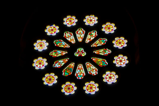 Stained glass window with floral pattern and arrangement