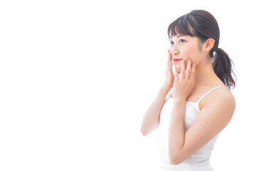 Fototapeta premium フェイシャルケアをする若い女性