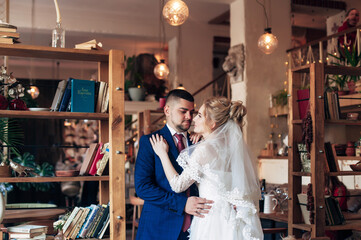 bride and groom hugging in a cozy room