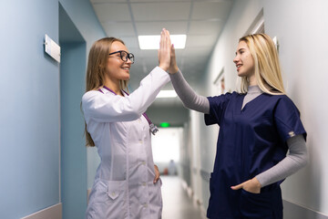 Doctors Team of Surgery gives High Five motivation in a clinic