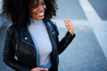 Happy black female smiling and gesticulating
