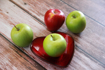green apple fruit on a wooden background