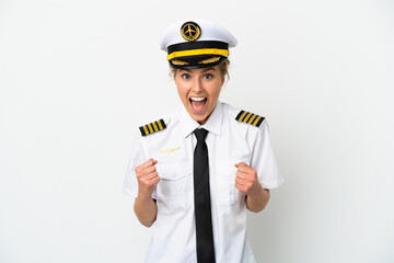 Airplane blonde woman pilot isolated on white background celebrating a victory in winner position