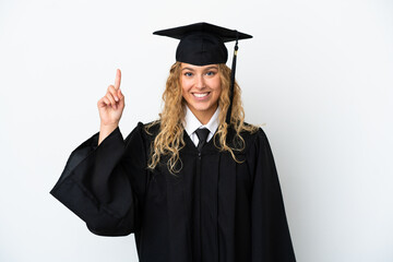 Young university graduate isolated on white background pointing up a great idea