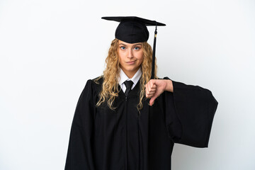 Young university graduate isolated on white background showing thumb down with negative expression
