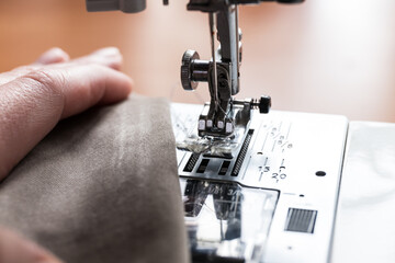Production line sewing machine. Needle and footstep detail