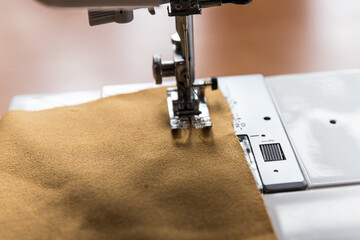 Production line sewing machine. Needle and footstep detail