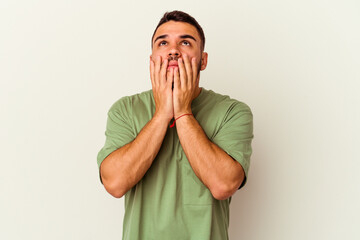 Young caucasian man isolated on white background whining and crying disconsolately.