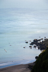 ocean, waves and the black sand beach