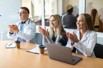 Fototapeta na wymiar Portrait of a medical team applauding in conference room