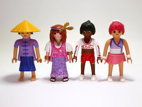 Playmobil collectible dolls. Different models of women. Tennis player. China. Japanese. Cheerleader. Hippie Girls. Clothing. Toys for girls and boys. Plastic figures. Fun. Play. Isolated white.