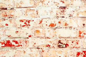 Orange brick wall with white spots. Background of orange bricks