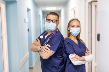Obraz na płótnie Canvas Portrait Of Medical Staff In Corridor Of Modern Hospital