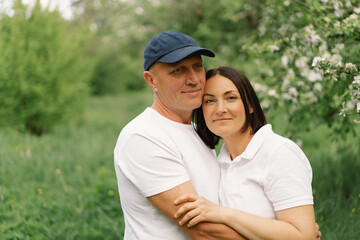 Portrait of an adult couple in love in the garden.