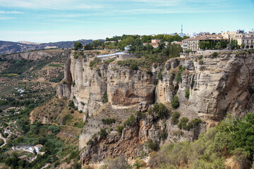 Fototapeta na wymiar Beautiful and old city of Ronda , in South of Spain province of Malaga - Andalucía. The town is situated on two hills divided by a deep ravine containing the Grande River. Touristic travel destination