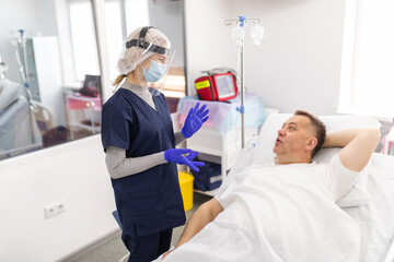 Obraz premium Hopeless mood on Infected covid19 patient during lying on bed at quarantine room area in hospital. Case from coronavirus covid 19 disease. Corona virus is world global social issue concept.