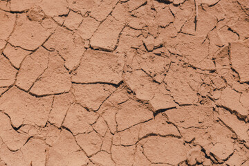 a piece of sun-cracked sand under the water