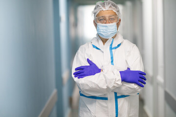 Male Doctor at hospital wearing medical mask to protect against coronavirus 2019 disease or COVID-19 global outbreak.