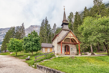 Fototapeta na wymiar Church next to the Braies Lake in the Dolomites
