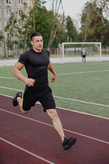 Obraz premium Man run on the stadium