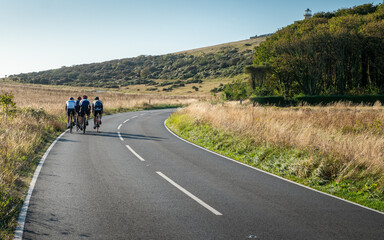 Cycling the South Downs, East Sussex, England. A group of road cyclists training on the quiet roads of the South English countryside.