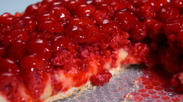 Close-up panorama of a piece of delicious Fresh raspberry pie covered with jelly