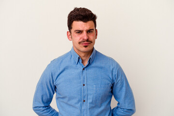 Young caucasian man isolated on white background sad, serious face, feeling miserable and displeased.