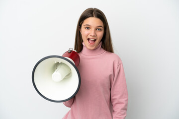 Little girl over isolated white background holding a megaphone and with surprise expression