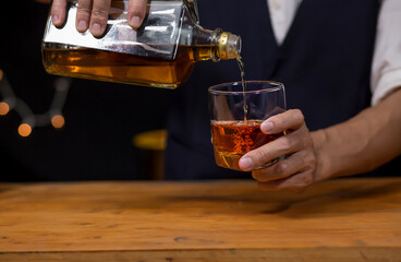 Bartender Serve Whiskey, on wood bar, 