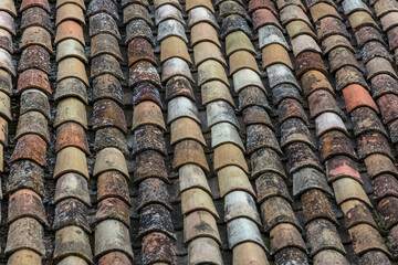 Pattern view of old orange tiles, used in the roofs of traditional architecture buildings, orange clay half-brim tile...