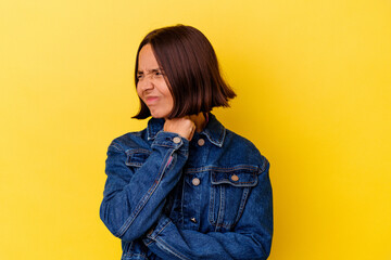 Young mixed race woman isolated on yellow background suffers pain in throat due a virus or infection.