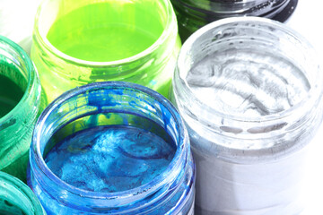 various paints in glass bottle