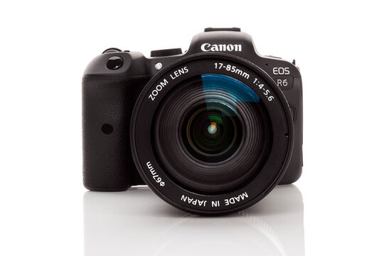 Canon R6. Digital mirrorless camera isolated on white background.