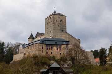 Medieval gothic castle Kost or Bone with tower in spring day, ancient fortresses on hill, fairytale stronghold, landmark in countryside, Bohemian Paradise or Cesky Raj, Czech Republic