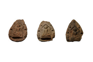 Set of ancient votive tablet, the Buddha seated in Subduing Mara gesture beneath the Mahabodhi Sikhara of Budh Gaya with his two disciples, isolated on white background.