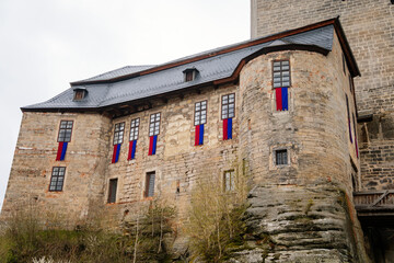 Medieval gothic castle Kost or Bone with tower in spring day, ancient fortresses on hill, fairytale stronghold, landmark in countryside, Bohemian Paradise or Cesky Raj, Czech Republic
