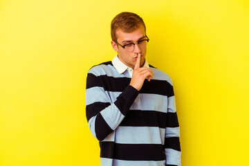 Young caucasian man isolated on yellow background