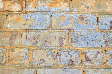 A fragment of a brick wall. The texture of the stone.