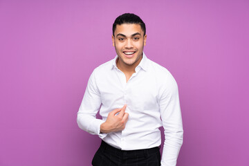 Asian handsome man isolated on blue background with surprise facial expression