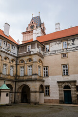 Gothic Castle Brandys nad Labem, Renaissance palace, clock tower, Historical Courtyard with sgraffito mural decorated plaster at facade, wall decor, Central Bohemian, Czech Republic