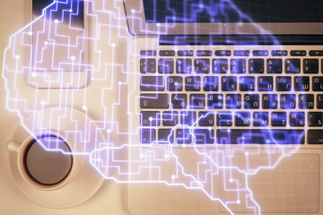 Double exposure of brain drawing hologram over topview work table background with computer. Concept of big data.