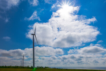 wind generator on a bright sunny day by the sea
