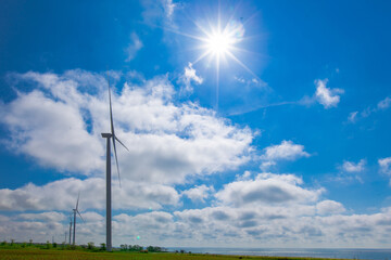wind generator on a bright sunny day by the sea