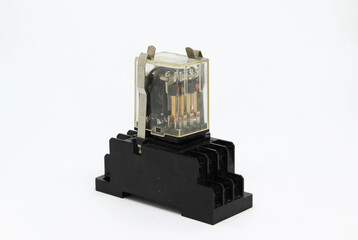 An electrical auxiliary relay in transparent plastic cases on white background.