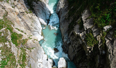 turquoise river between the rocks in Switzerland