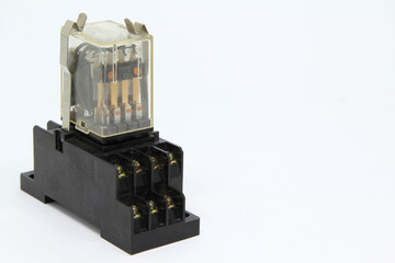 An electrical auxiliary relay in transparent plastic cases on white background.